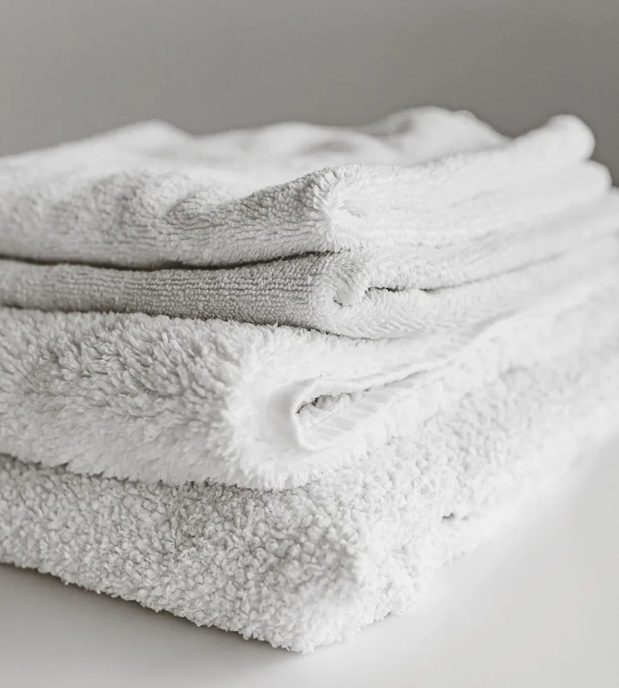 Folded white towels showing textile texture
